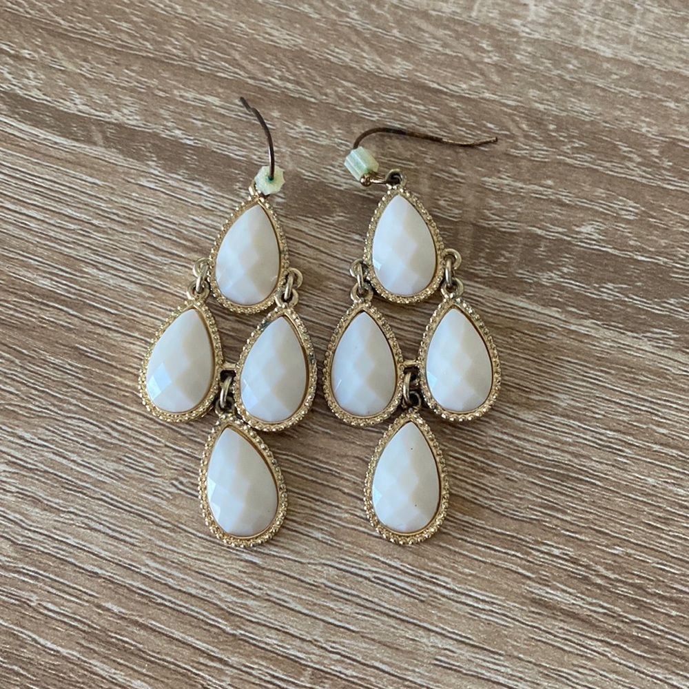 White and gold colored earrings